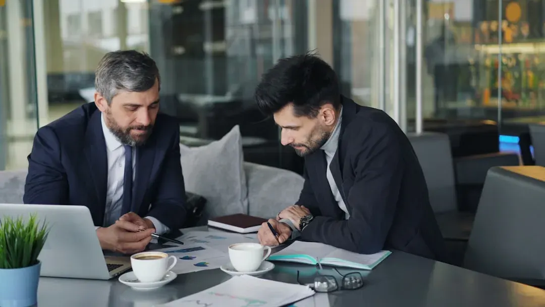 Government tax professionals analyzing tax compliance files