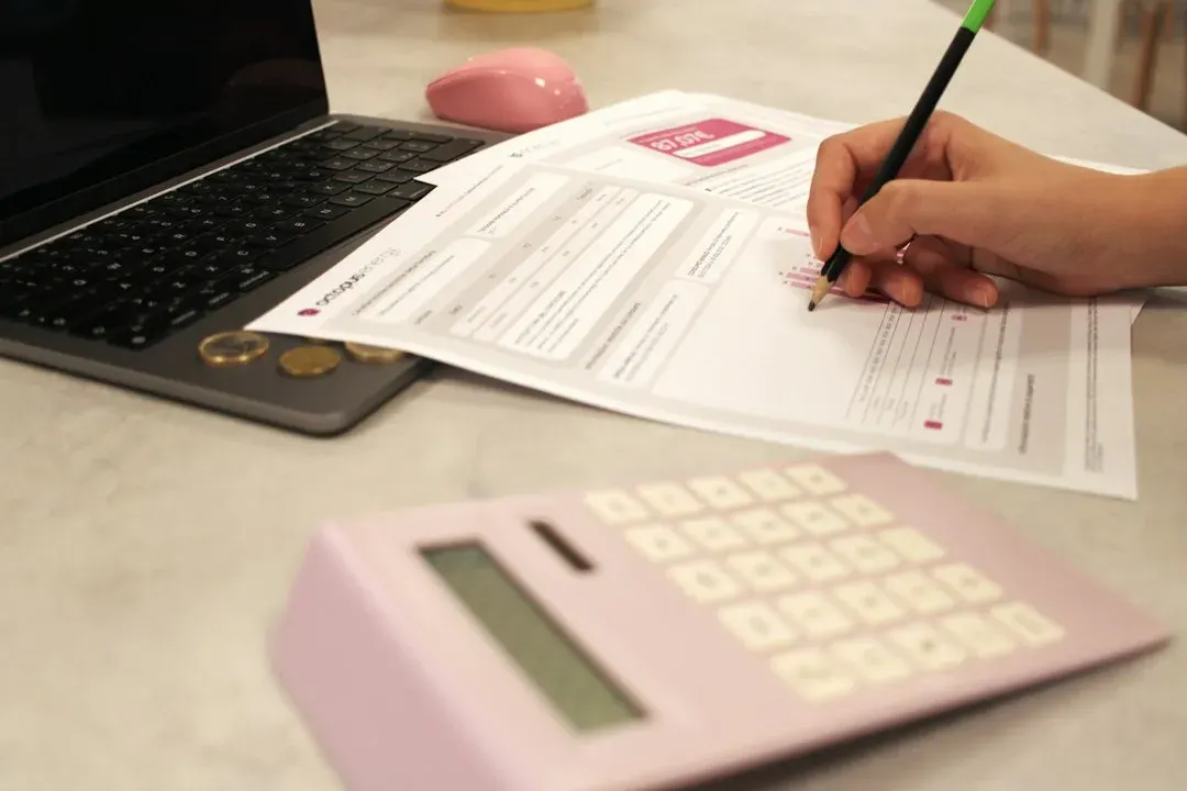 person calculating tax penalties and fees - IRS payment plan attorney