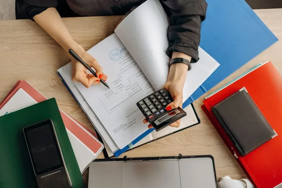 Tax auditor reviewing corporate financial books and tax records